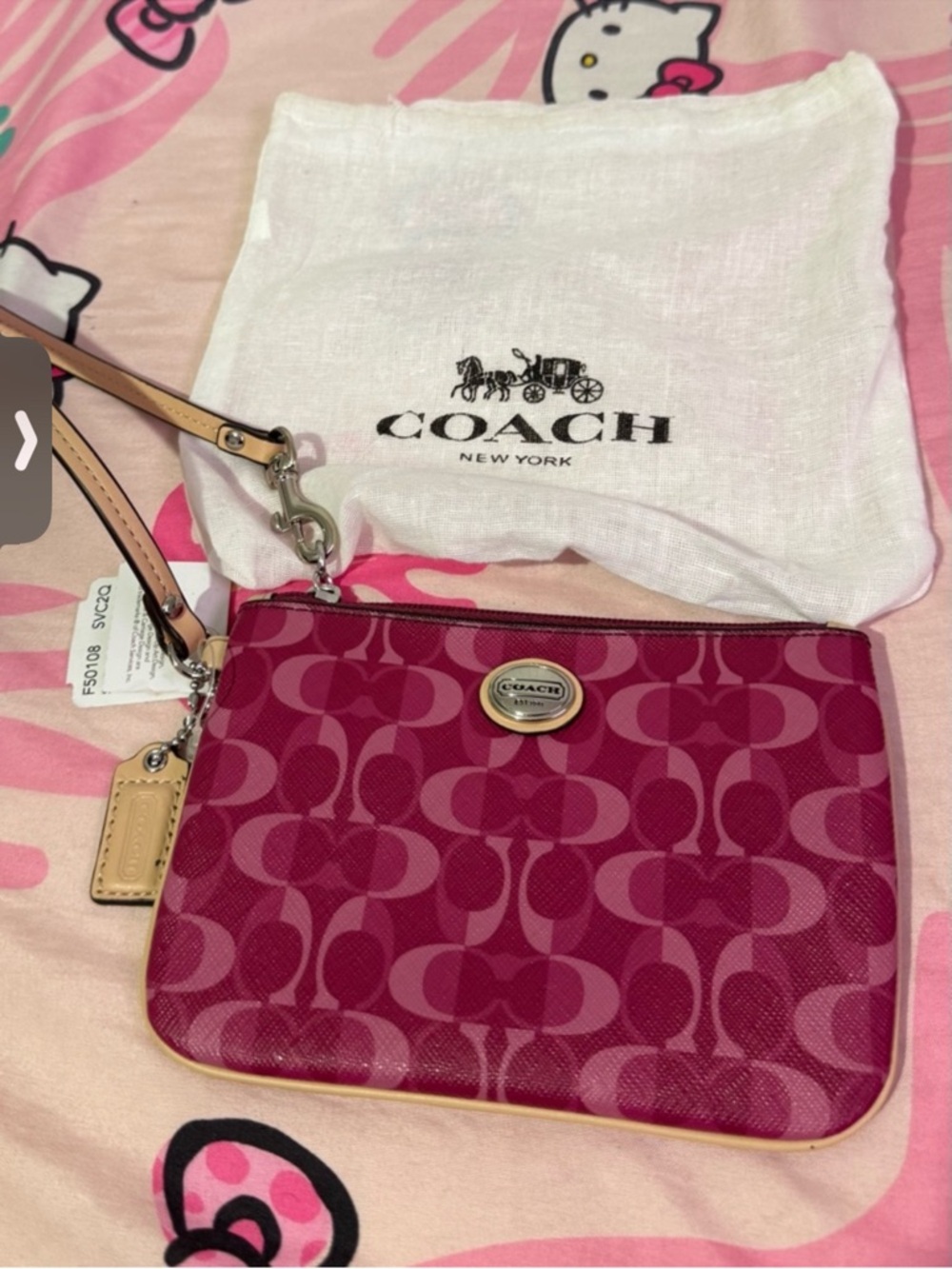 Coach Pink Signature Wristlet with Tan Strap